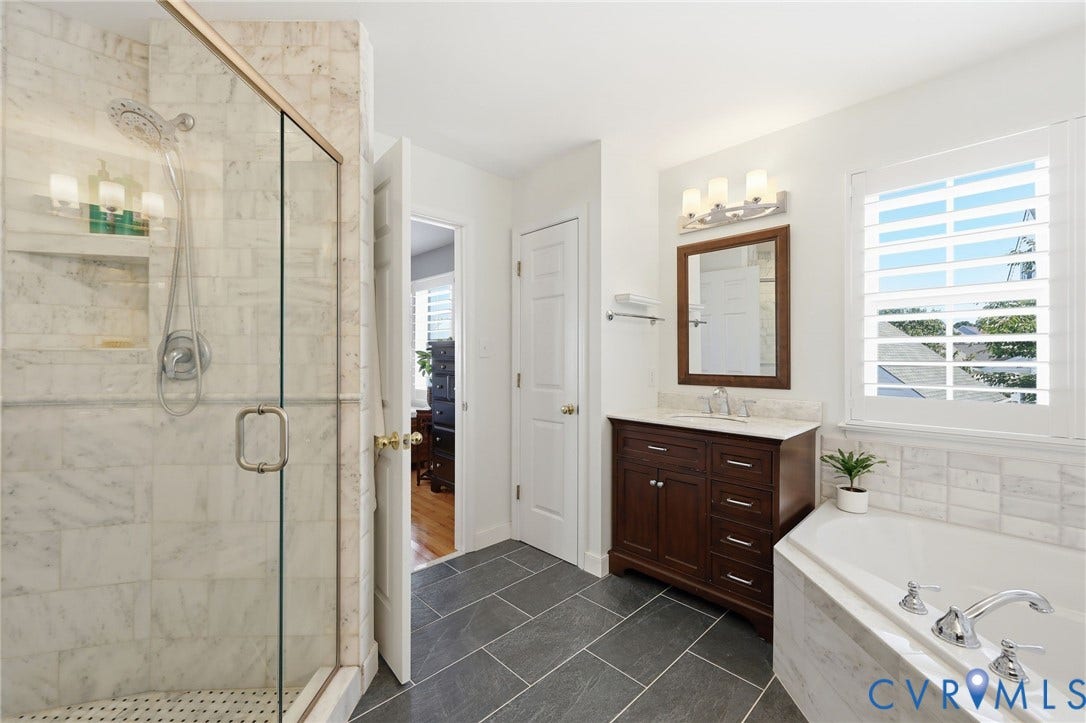 4909 Parsons Walk Place, Twin Hickory, Glen Allen, VA 23059 Glass-enclosed shower with marble-finish tile, a built-in niche, and a rain showerhead