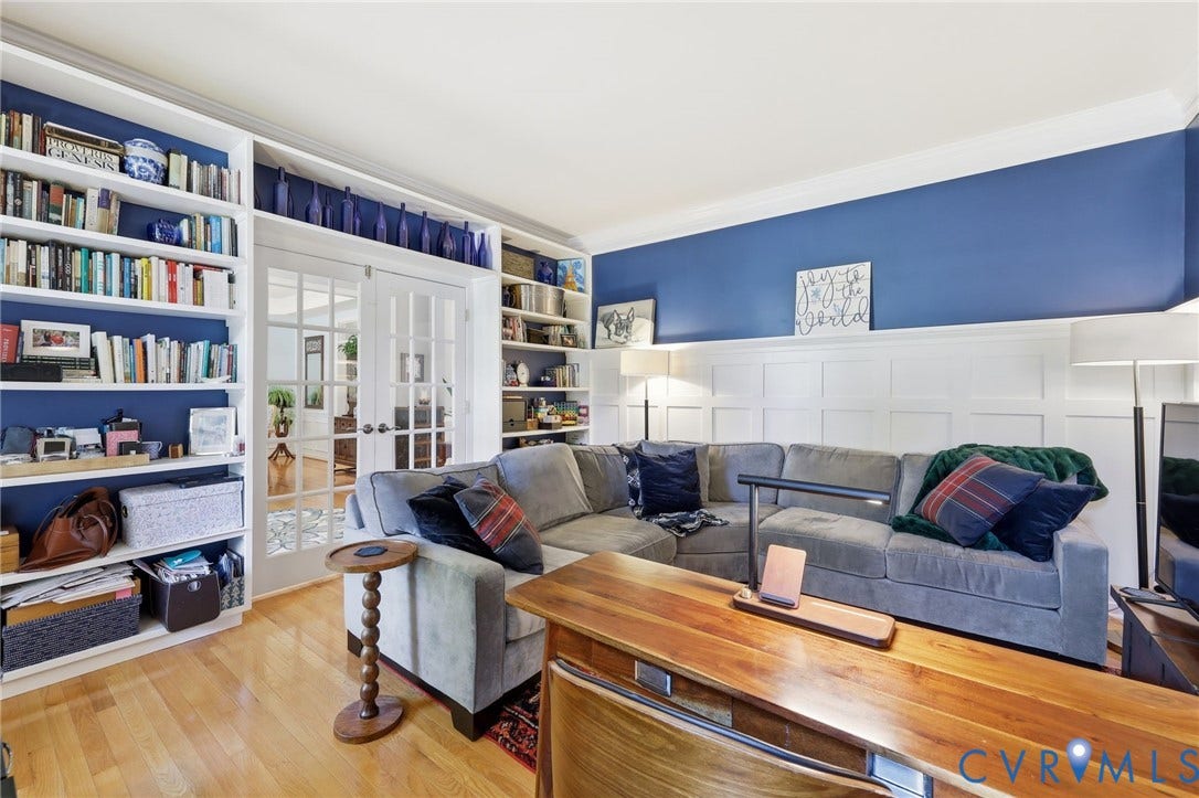 4909 Parsons Walk Place, Twin Hickory, Glen Allen, VA 23059 Living area featuring wood-finish flooring, built-in shelving, white paneled wall detailing, and glass-paneled French doors