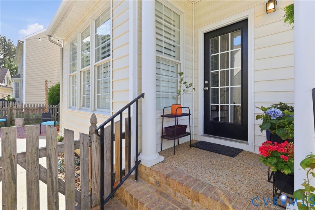 4909 Parsons Walk Place, Twin Hickory, Glen Allen, VA 23059 Inviting entryway featuring a paneled glass door, brick steps, a wrought iron handrail, and white siding