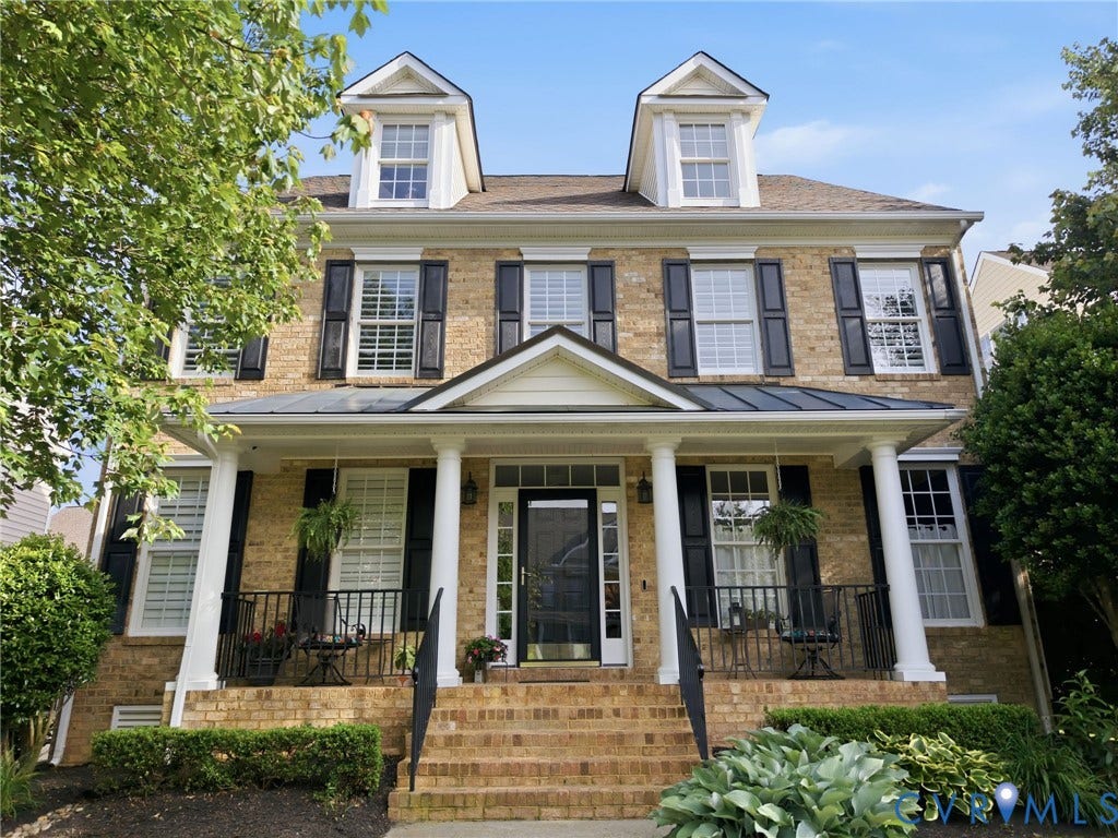 4909 Parsons Walk Place, Twin Hickory, Glen Allen, VA 23059 North Facing Brick facade residence featuring a covered front porch with white columns, black window shutters, and two prominent dormer windows