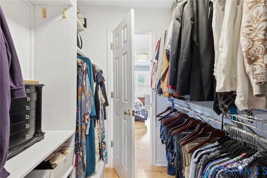 4909 Parsons Walk Place, Twin Hickory, Glen Allen, VA 23059 Custom closet system with white shelving, wire racking, and integrated hanging rods, providing ample storage
