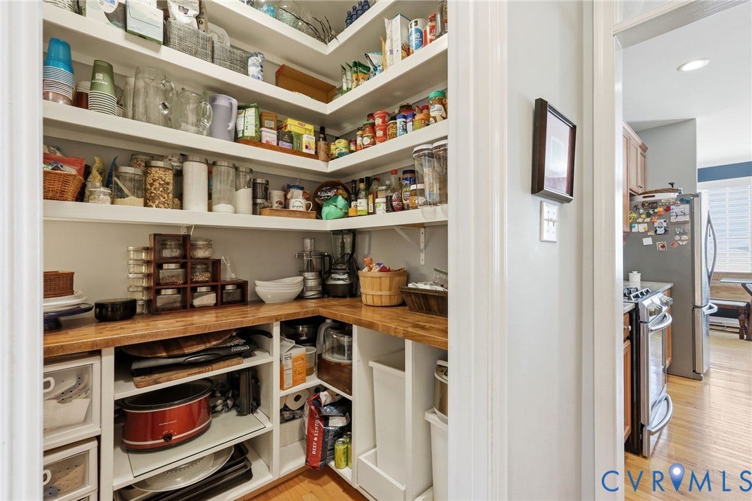 4909 Parsons Walk Place, Twin Hickory, Glen Allen, VA 23059 Walk-in pantry featuring extensive built-in shelving, wood-finish countertops, and under-counter storage