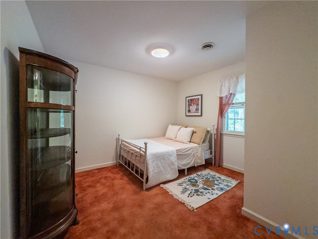 Lower level bedroom with access to full bath