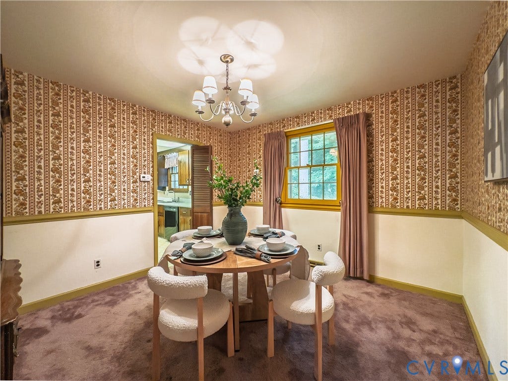 Dedicated dining room with chair rail and chandelier