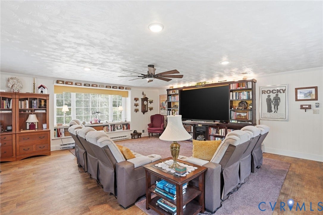 11016 Pridesville Road, Amelia, VA 23002 Spacious living area featuring wood-finish flooring, a large bay window, recessed lighting, and a ceiling fan