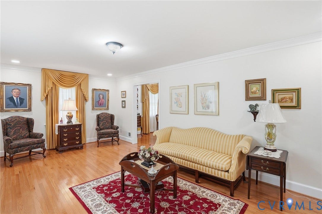 11016 Pridesville Road, Amelia, VA 23002 Hardwood flooring throughout this living area, featuring crown molding, recessed lighting, and a neutral wall palette