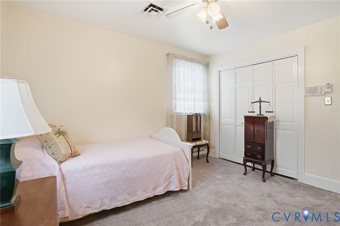 11016 Pridesville Road, Amelia, VA 23002 Room featuring light-toned walls, grey carpet flooring, and a white bi-fold closet