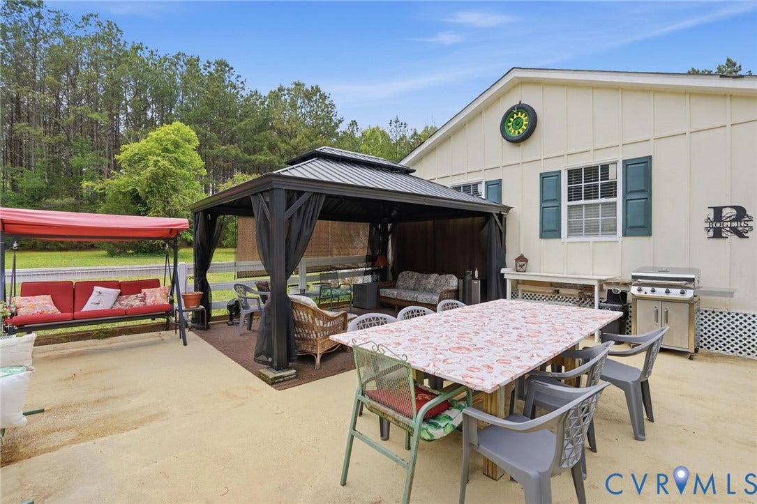 11016 Pridesville Road, Amelia, VA 23002 Expansive outdoor living area featuring a large concrete patio