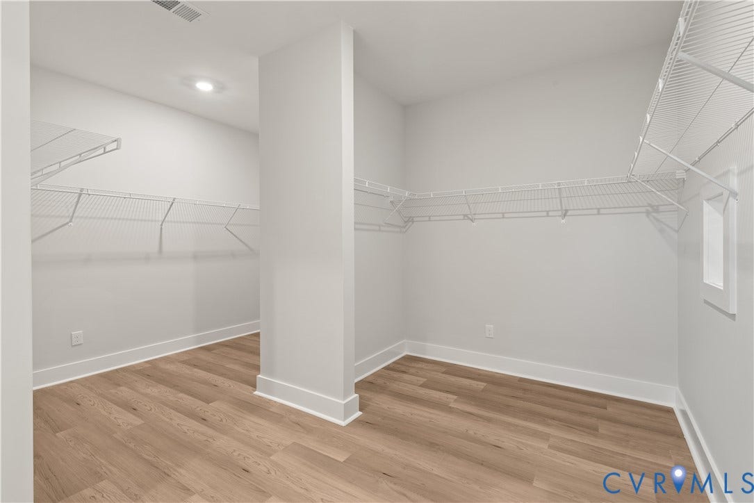 5758 Stingray Point Boulevard, Greenwood Estates, New Kent, VA 23124 Primary Bedroom WIC. This home is to be built. The photo represents the plan, not the actual home. Designs has been selected.
