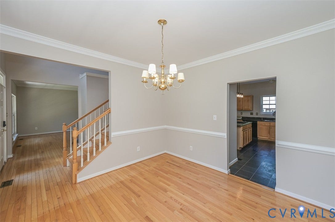 1926 Greenwood Glen Drive, Glen Allen, VA 23059 Dining room with wood moldings and wood floor.