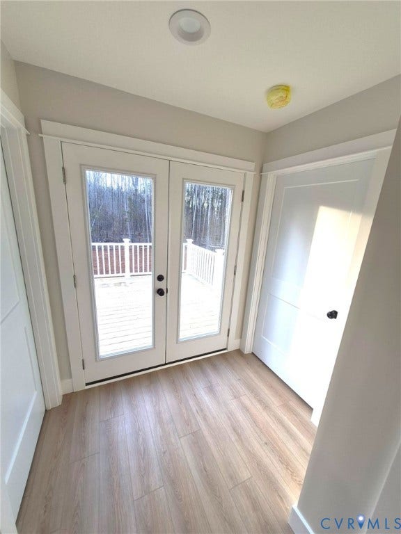 Double French doors open to a private outdoor deck