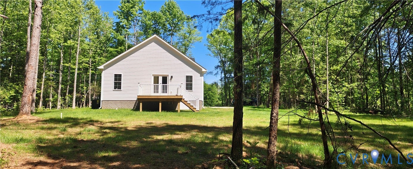 White siding exterior with a pitched roof