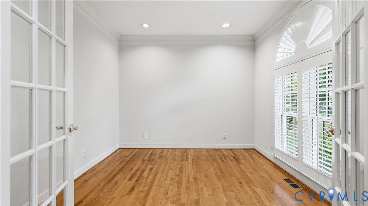 12400 Chadsworth Place, Wyndham, Glen Allen, VA 23059 Hardwood flooring throughout this room featuring white walls, recessed lighting, and crown molding