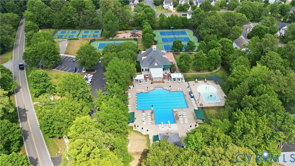 12400 Chadsworth Place, Wyndham, Glen Allen, VA 23059 Community clubhouse featuring a large outdoor swimming pool, a separate shallow aquatic play area, multiple tennis courts, and a dedicated parking area