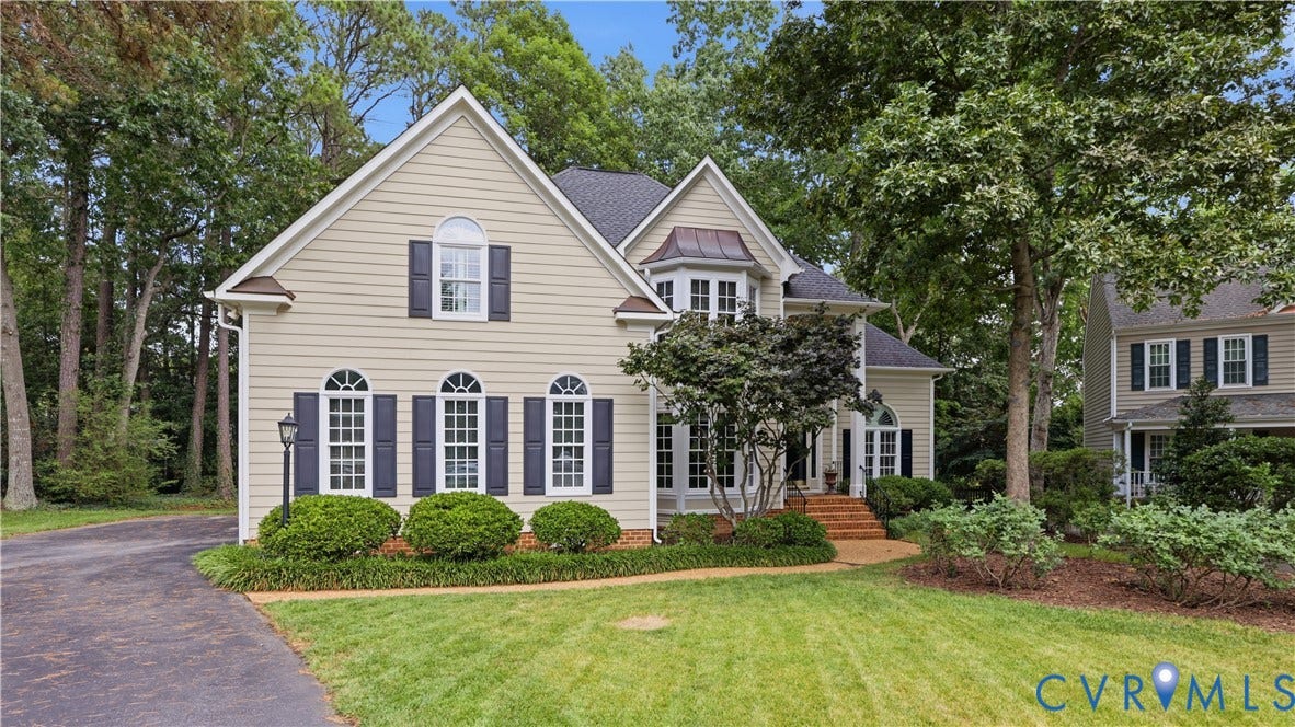 12400 Chadsworth Place, Wyndham, Glen Allen, VA 23059 Cream-colored siding exterior with dark shutters and a dark shingle roof