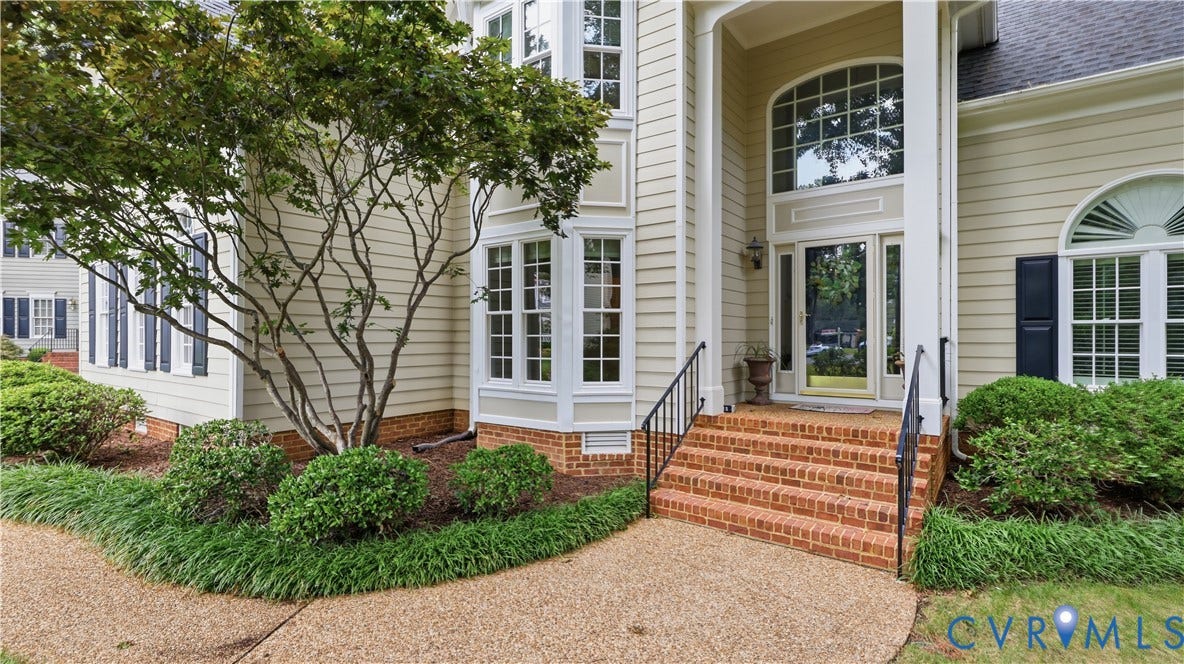 12400 Chadsworth Place, Wyndham, Glen Allen, VA 23059 Exterior entry featuring a brick stairway with black wrought iron railings, a full-light front door with a transom window, and an arched window