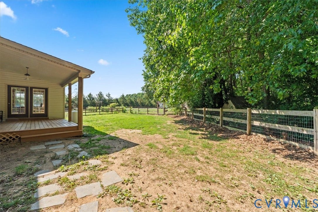 Spacious outdoor deck with wood flooring and covered porch ceiling
