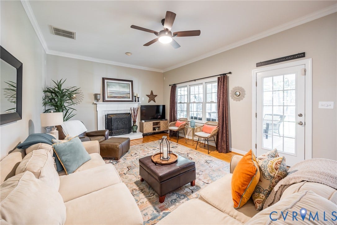 5541 Summer Creek Way, Millstone, Glen Allen, VA 23059 Family room with gas fireplace and door to the screened in porch.
