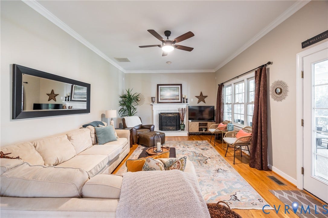 5541 Summer Creek Way, Millstone, Glen Allen, VA 23059 Family room with gas fireplace and door to the screened in porch.