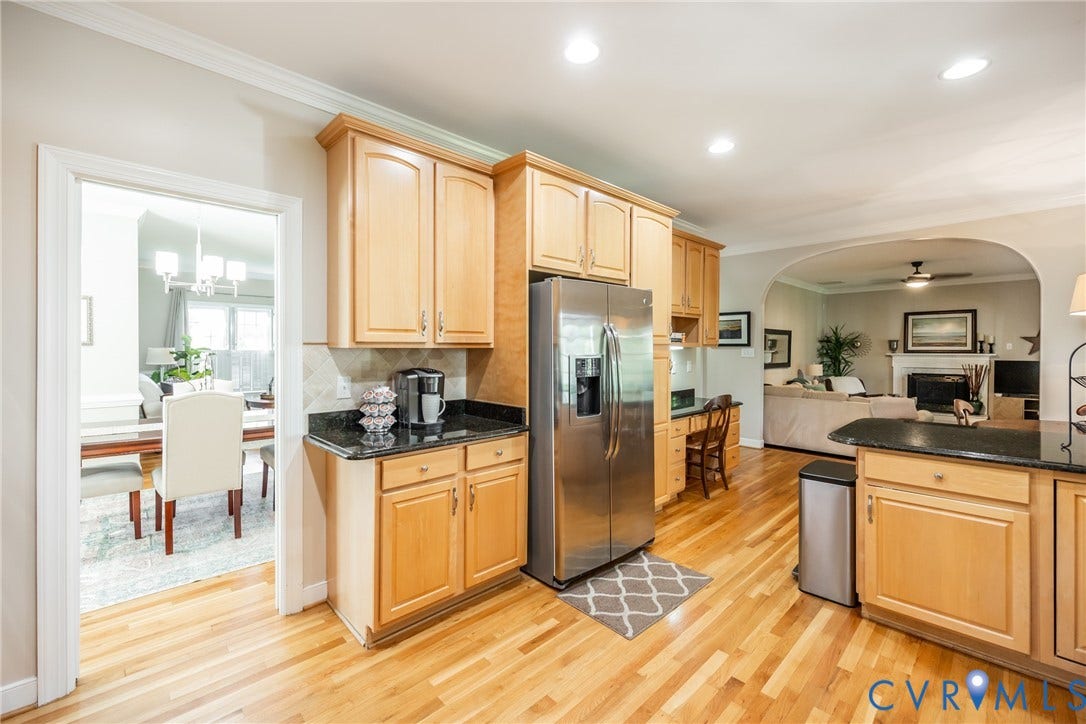 5541 Summer Creek Way, Millstone, Glen Allen, VA 23059 View that shows the dining room, kitchen and the step-down family room in the background.