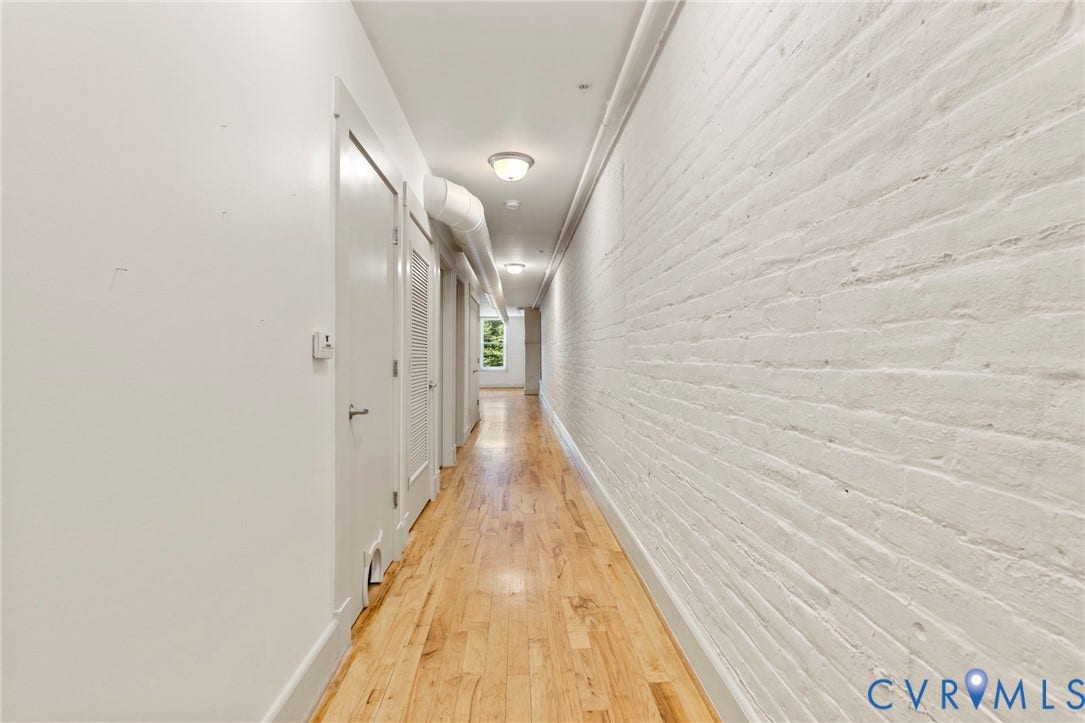 407 S Cherry Street, #U202, Oregon Hill, Richmond, VA 23220 Enter to long foyer with access to bedrooms, bathroom and Laundry closet. Opens to living area at the end of hallway.