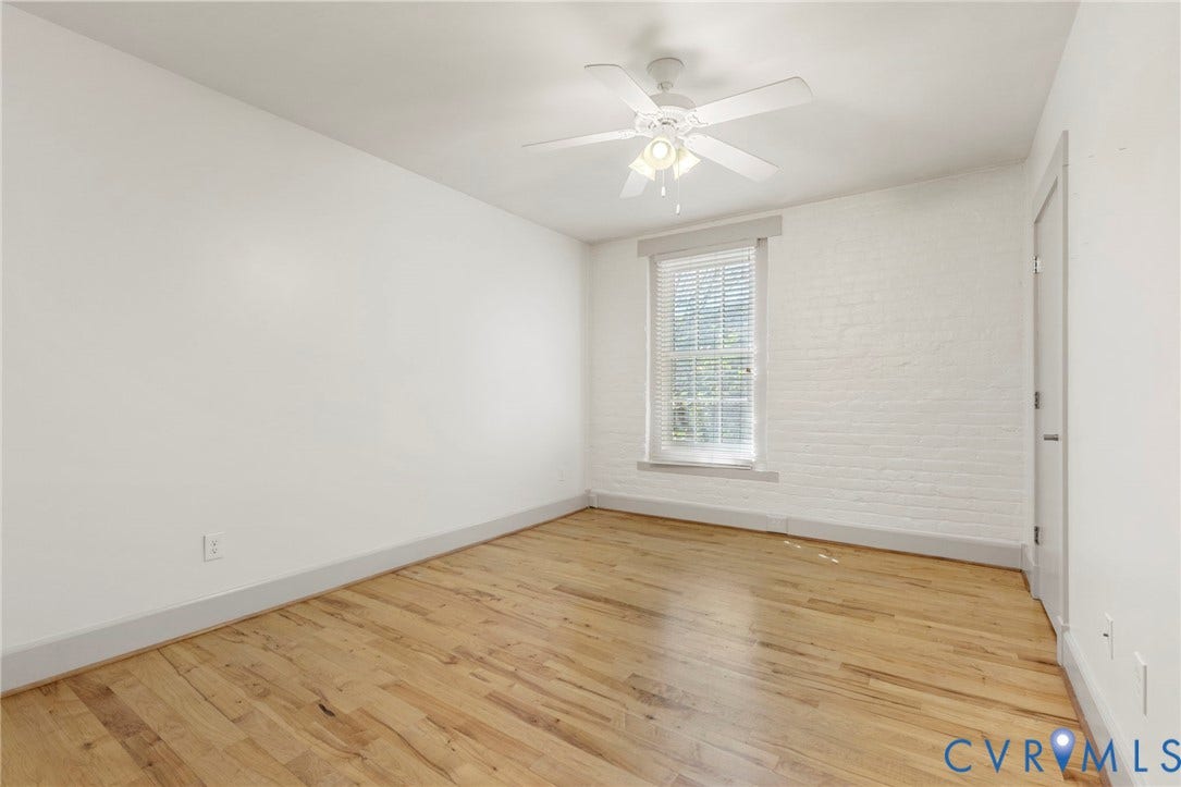 407 S Cherry Street, #U202, Oregon Hill, Richmond, VA 23220 Second bedroom with wood floors, ceiling fan with light fixture and walk in closet