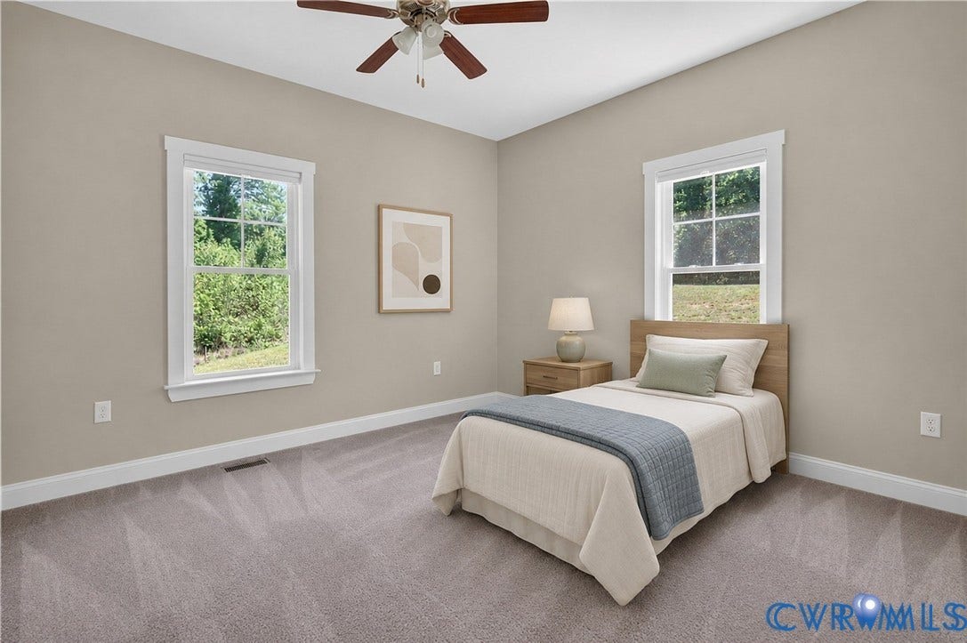 3834 Three Chopt Road, Nonw, Goochland, VA 23065 Interior room featuring two double-hung windows, a ceiling fan with integrated lighting, neutral wall paint, and gray carpet flooring
