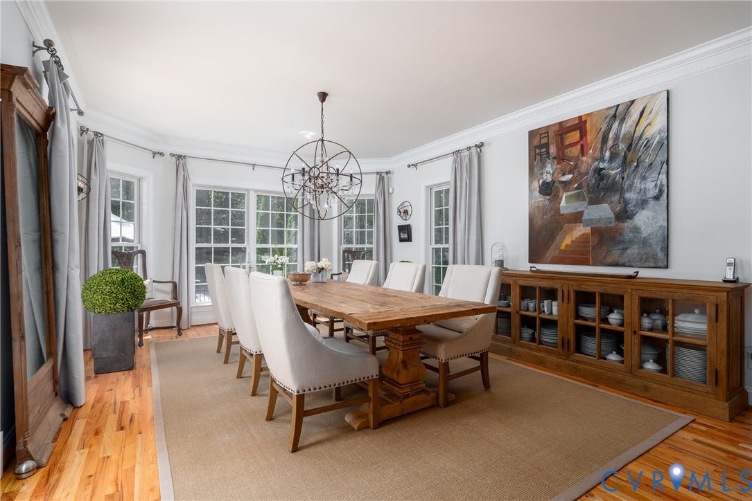 3124 Rock Cress Lane, Mill Forest, Sandy Hook, VA 23153 Banks of windows accentuate the Dining Room. Iron and glass chandelier and sconces are rustic but elegant.