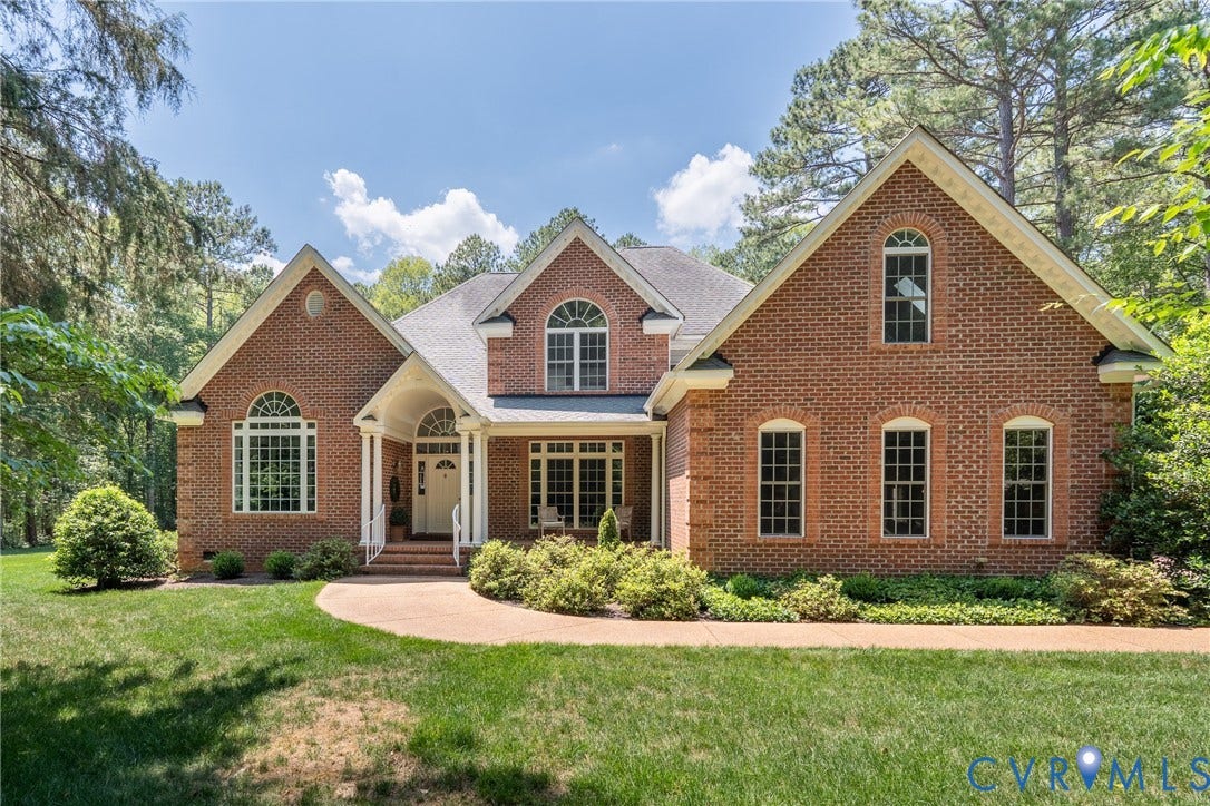 3124 Rock Cress Lane, Mill Forest, Sandy Hook, VA 23153 Two-story transitional brick residence, custom built in 2003, sits on three lush acres in private Mill Forest in Sandy Hook.