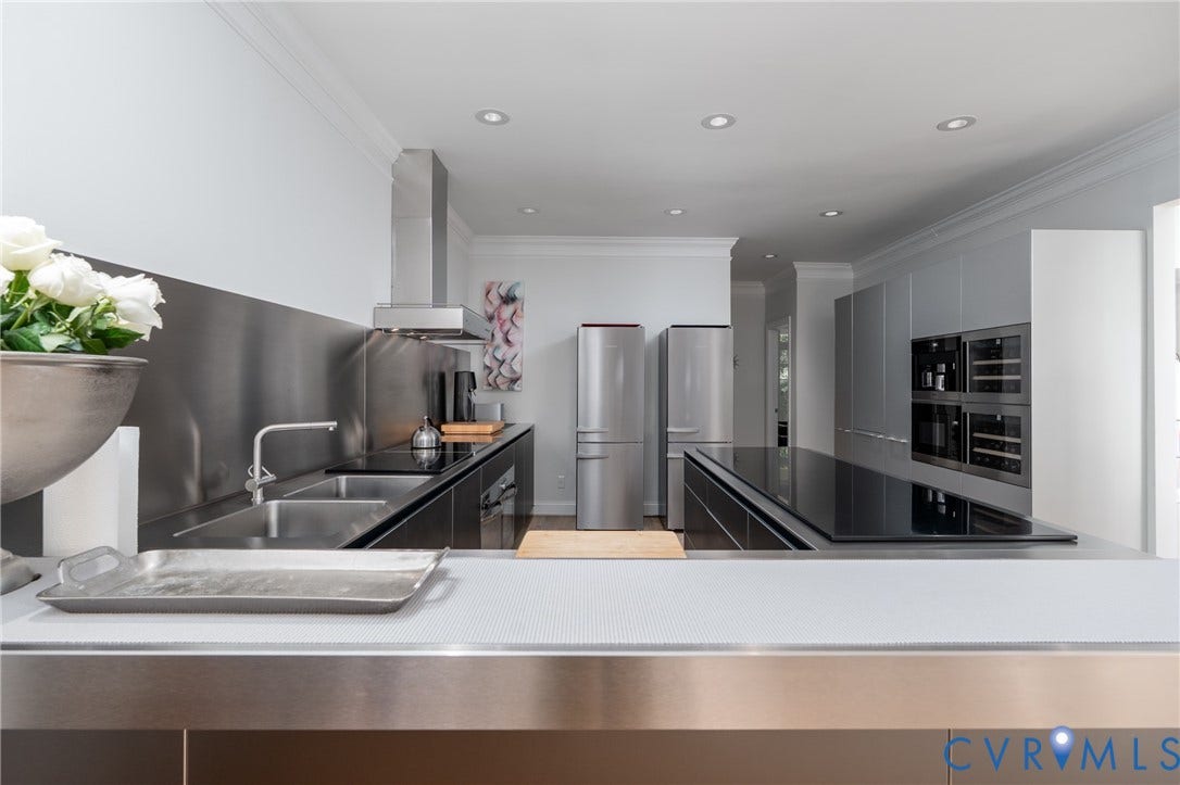 3124 Rock Cress Lane, Mill Forest, Sandy Hook, VA 23153 Deep double sinks and double refrigerators are among the Bulthaup and Miele fixtures. A handsome bar separates the Kitchen from the Dining Room.