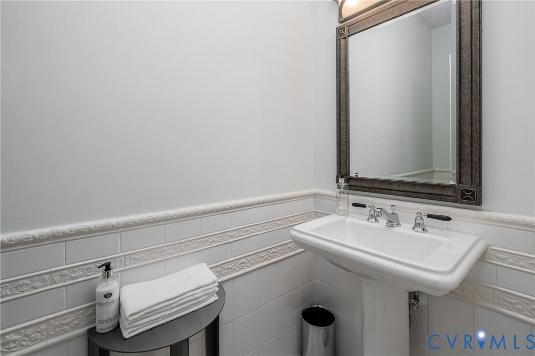 3124 Rock Cress Lane, Mill Forest, Sandy Hook, VA 23153 First Floor Powder Room with pedestal sink and decorative tile wainscoting