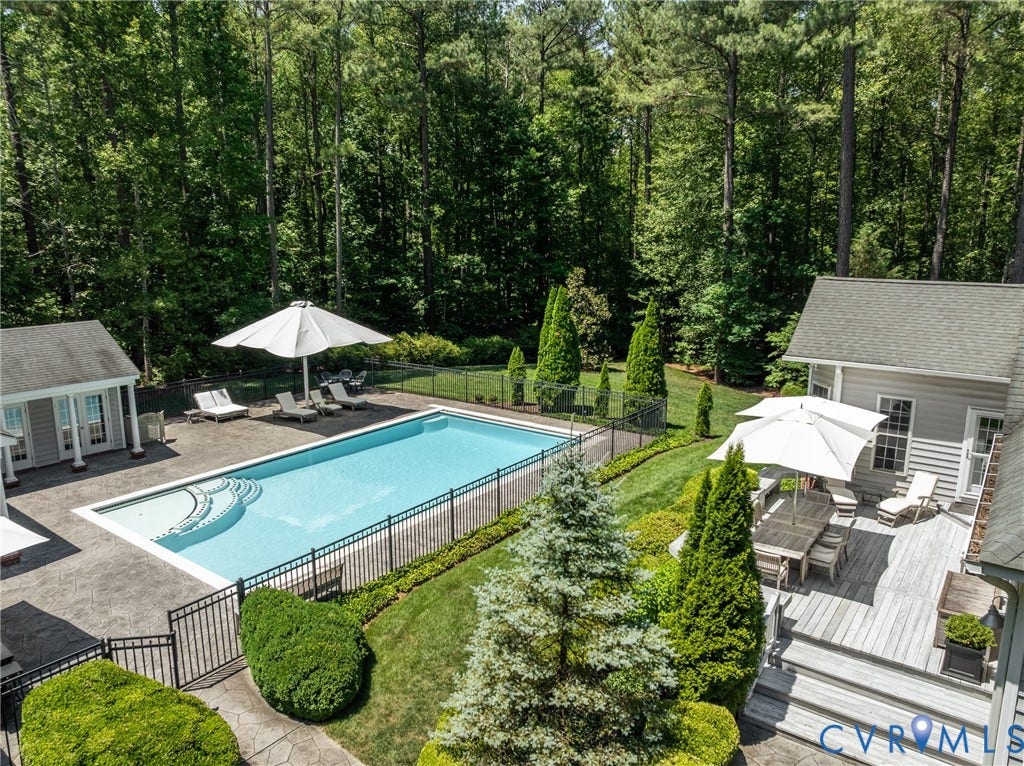 3124 Rock Cress Lane, Mill Forest, Sandy Hook, VA 23153 Totally fenced, the Pool area is a fully equipped oasis with stamped concrete "limestone" pavers and a saltwater, heated gunite pool. Dedicated lap lane, shallow semi circle ease-in steps and lovely decorative tile accents are an aesthetic fusion of form and function.