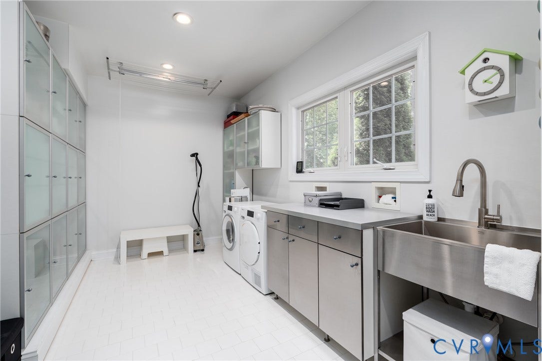 3124 Rock Cress Lane, Mill Forest, Sandy Hook, VA 23153 Sleek frosted glass front storage cabinets, deep stainless laundry sink, hanging clothes operational system, Miele washer and dryer and two windows in a Laundry Room you'll want to spend time in.