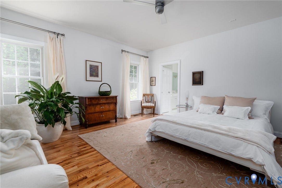 3124 Rock Cress Lane, Mill Forest, Sandy Hook, VA 23153 Serene and soothing, the Primary Bedroom with hardwood floors, ceiling fan and two deep windows has an en suite Bath.