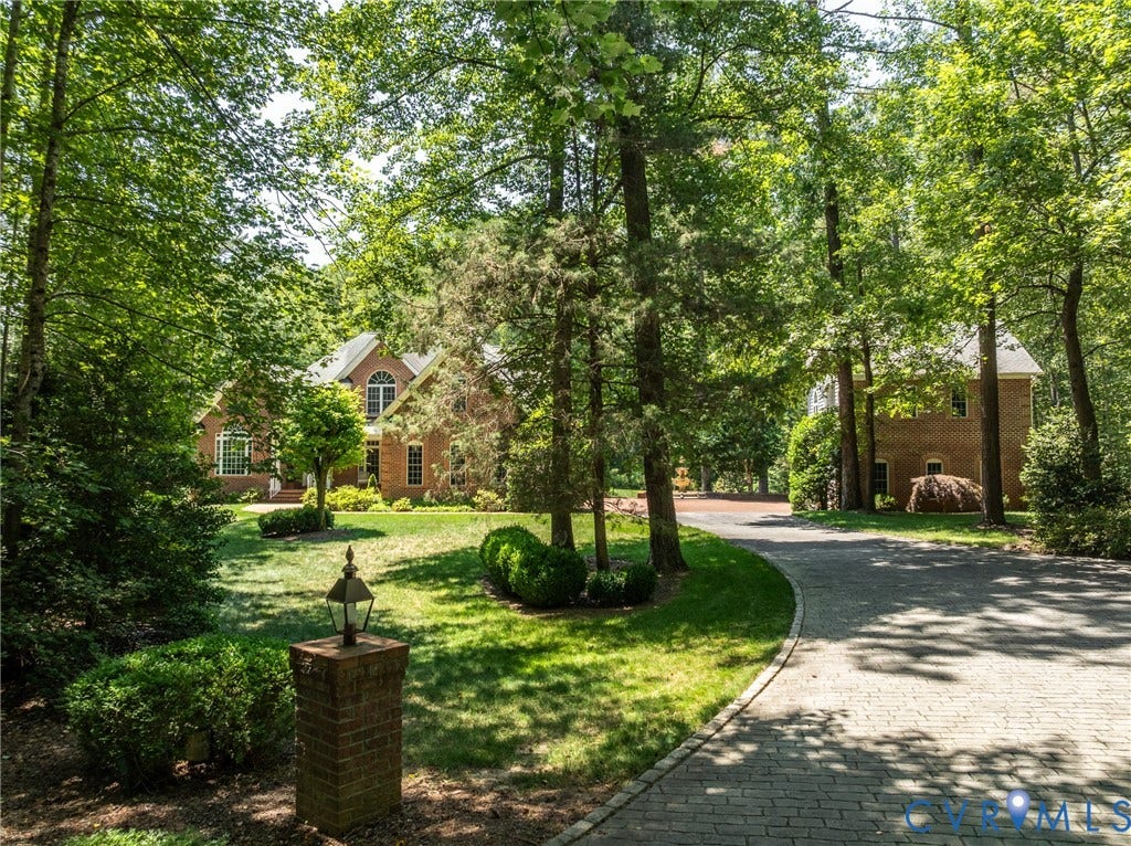 3124 Rock Cress Lane, Mill Forest, Sandy Hook, VA 23153 A glimpse of the beautifully landscaped complex showcases the main House and a garage Guest House.