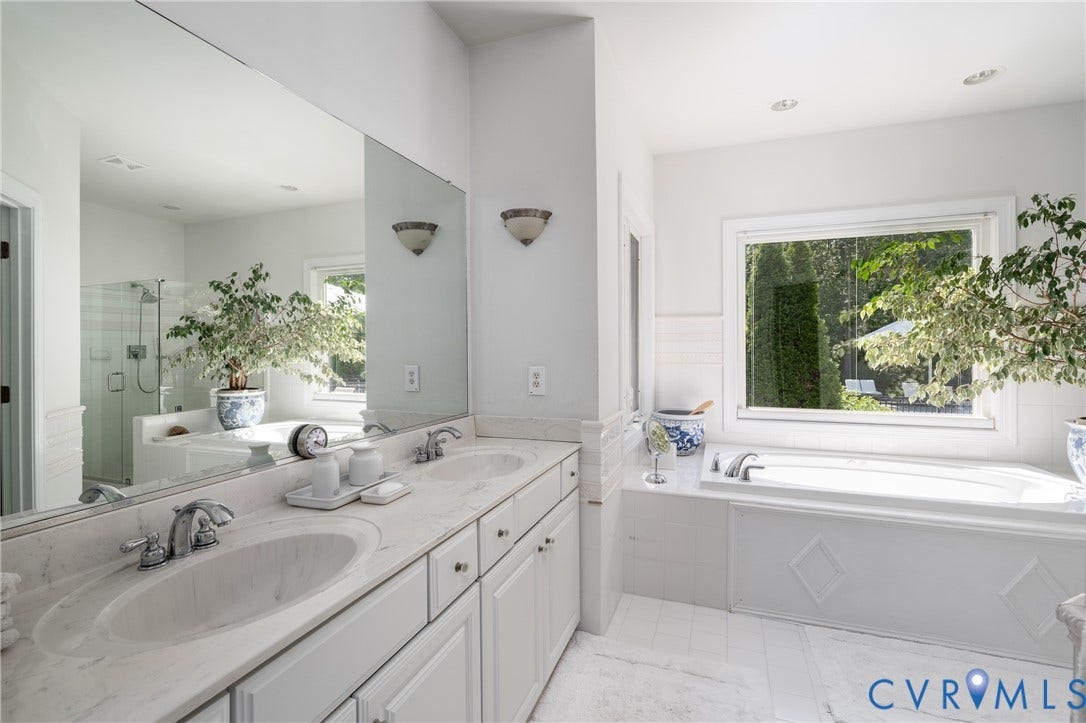 3124 Rock Cress Lane, Mill Forest, Sandy Hook, VA 23153 Double vanity with integrated sinks, a "limestone" ceramic tile floor and a deep Cielo jetted tub in the Primary Bath