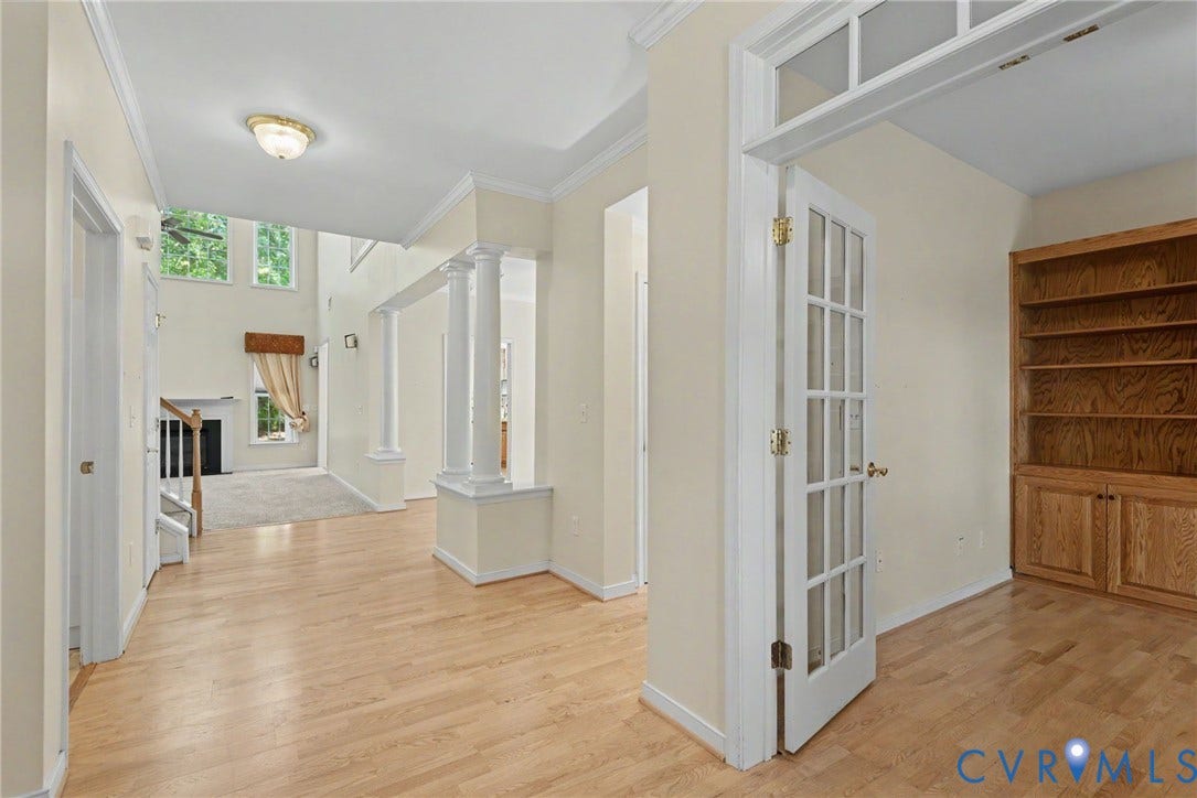Entryway featuring light wood-finish flooring, recessed lighting, and crown molding