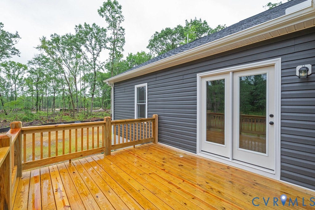 9256 Fredericks Hall Road, Con Creek, Mineral, VA 23117 Spacious wood-finish deck with natural wood railing