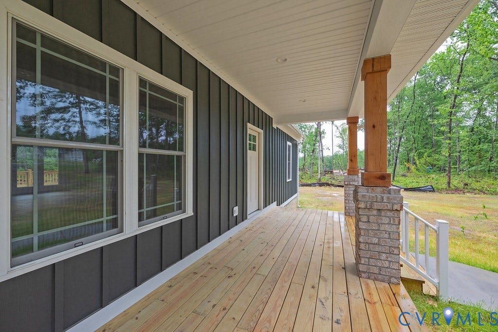 9256 Fredericks Hall Road, Con Creek, Mineral, VA 23117 Covered front porch featuring wood-finish flooring