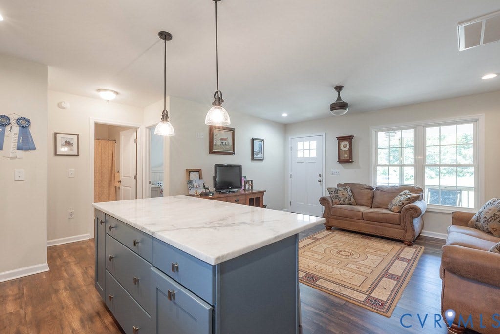 4336 Hells Bend Road, Quiet And Private, Palmyra, VA 22963 Kitchen island featuring a marble countertop, blue cabinetry, and pendant lighting