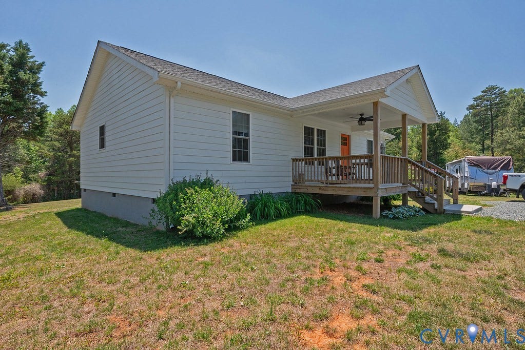 4336 Hells Bend Road, Quiet And Private, Palmyra, VA 22963 White hardiplank like siding exterior with a covered wooden porch, featuring an orange entry door, and a dark shingle roof