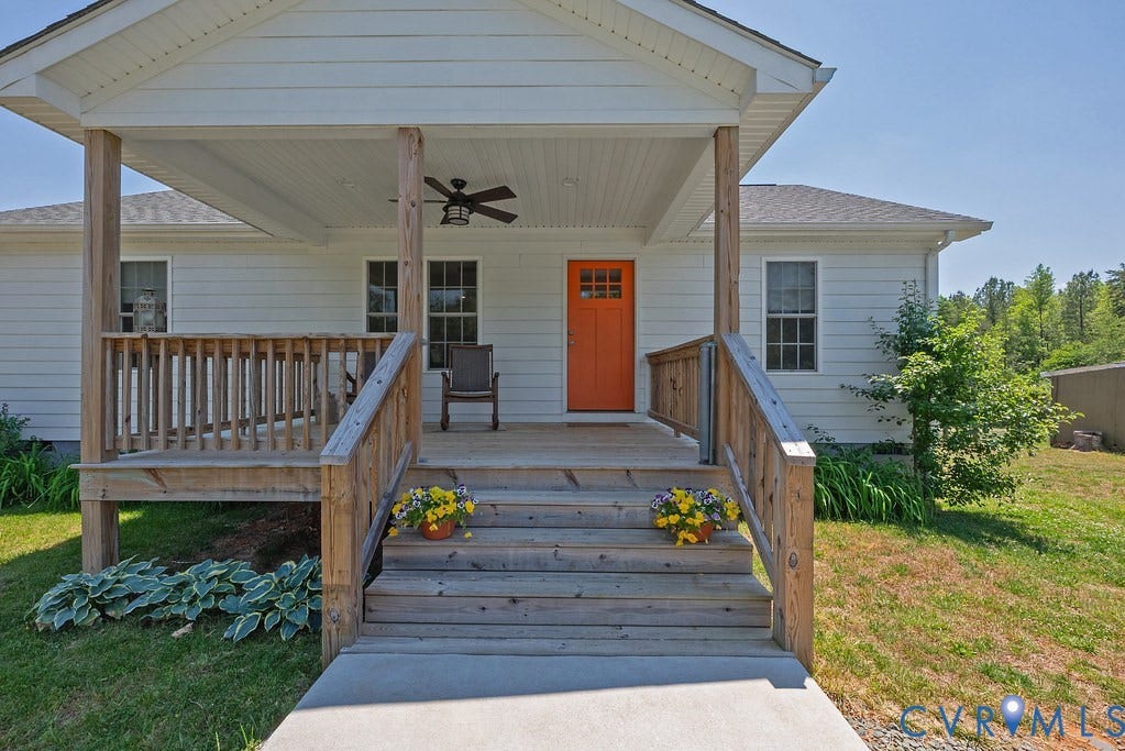 4336 Hells Bend Road, Quiet And Private, Palmyra, VA 22963 Inviting front porch with natural wood railing and stairs, white vinyl siding, and a vibrant orange entry door