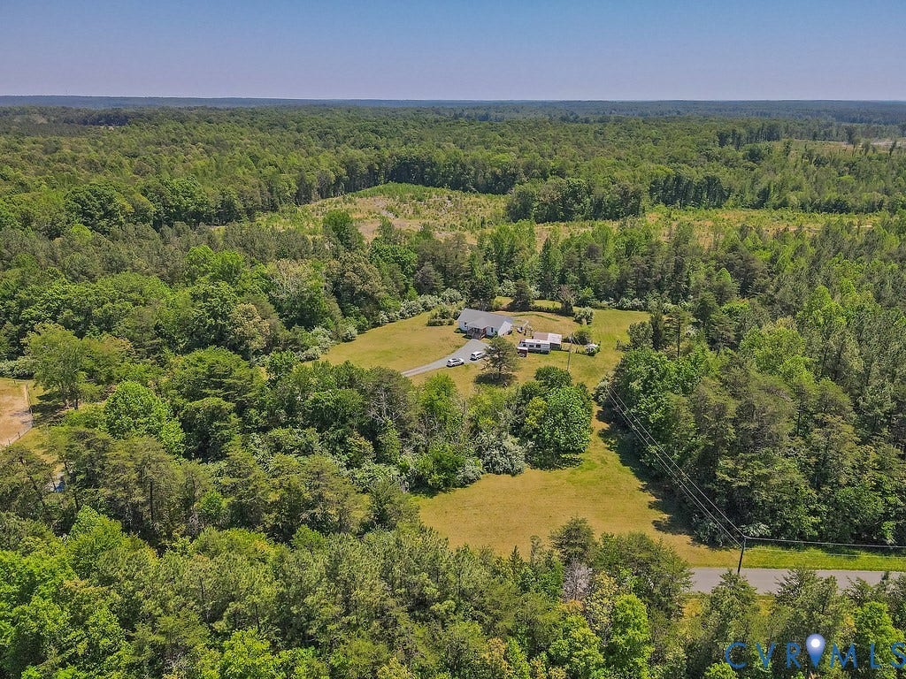 4336 Hells Bend Road, Quiet And Private, Palmyra, VA 22963 Expansive property featuring a single-story residence with a white exterior, surrounded by extensive green landscaping and mature trees