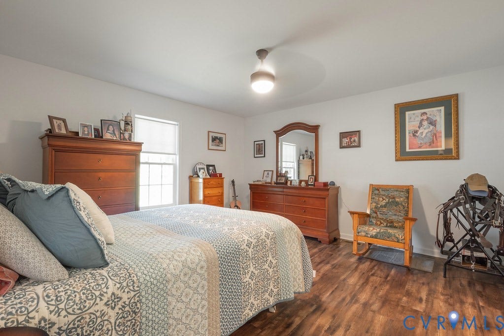 4336 Hells Bend Road, Quiet And Private, Palmyra, VA 22963 Spacious room featuring wood-finish flooring, a ceiling fan with integrated lighting, and white painted walls