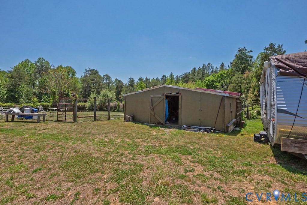 4336 Hells Bend Road, Quiet And Private, Palmyra, VA 22963 Outbuilding structure featuring a single door opening and an adjacent mobile structure