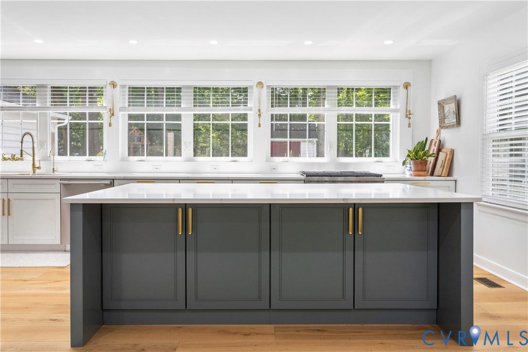 10100 Contessa Court, Glen Allen, VA 23060 Kitchen island with a white countertop and dark gray cabinetry featuring gold-tone hardware