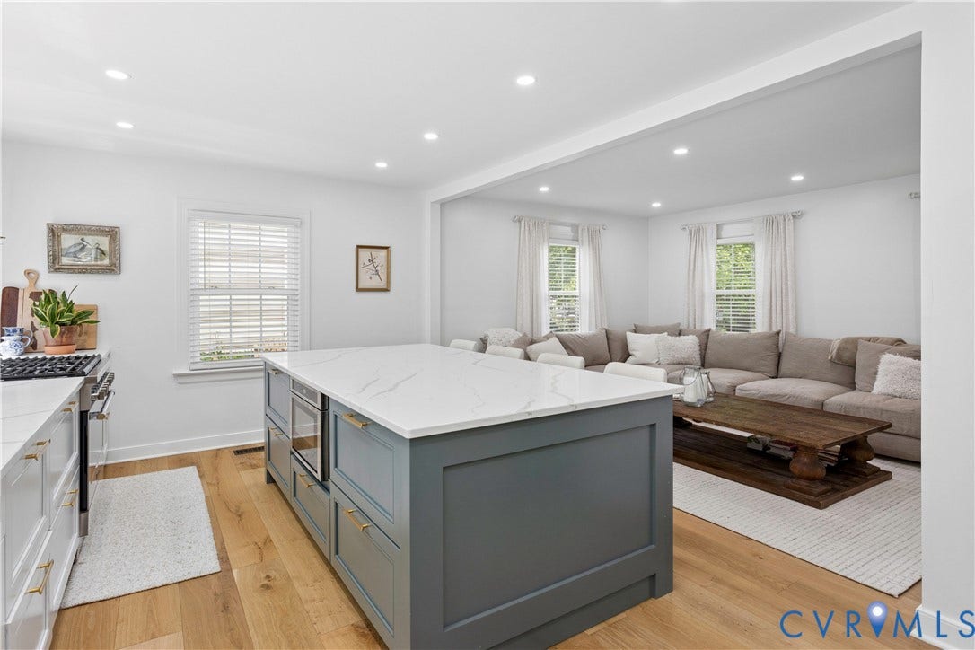 10100 Contessa Court, Glen Allen, VA 23060 Kitchen featuring a large island with white countertop, integrated microwave, and ample storage