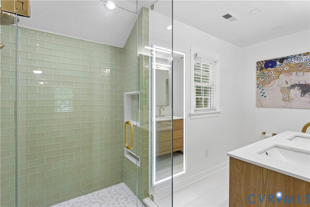 10100 Contessa Court, Glen Allen, VA 23060 Glass-enclosed shower featuring light green subway tile, a built-in niche, and a gold-finish handle