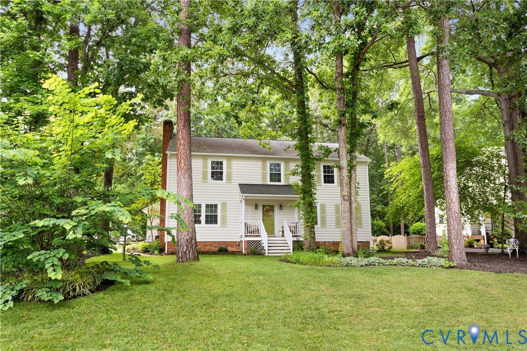 10100 Contessa Court, Glen Allen, VA 23060 Two-story residence featuring light-colored siding, contrasting shutters, and a prominent front porch with white railings