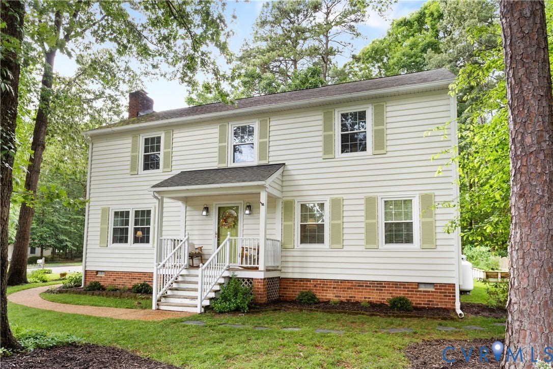 10100 Contessa Court, Glen Allen, VA 23060 Two-story residence featuring light-colored siding with contrasting shutters and a brick foundation